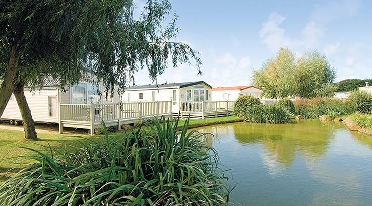 picturesque lake in front of caravans