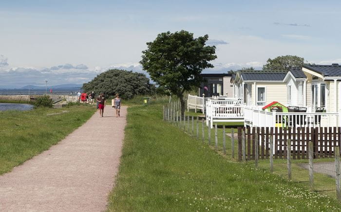 Holiday homes overlooking the coastal marina at Nairn Lochloy Holiday Park