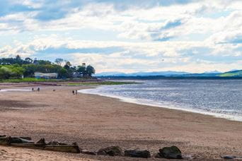 Costal scene of sandy beach and blue sea