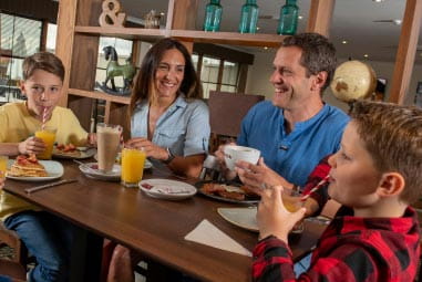 Family eating at a table in a restaurant