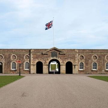 Large stately brick property with union jack flag