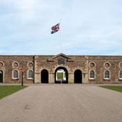 Large stately brick property with union jack flag