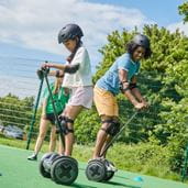 Kids stood on a segway