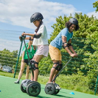 Kids stood on a segway