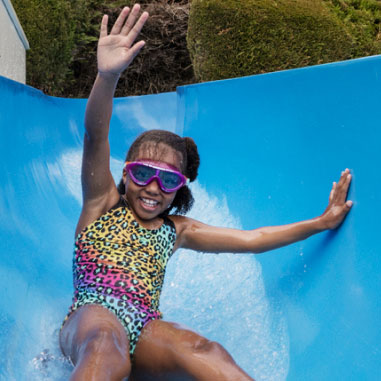 A child riding a water flume