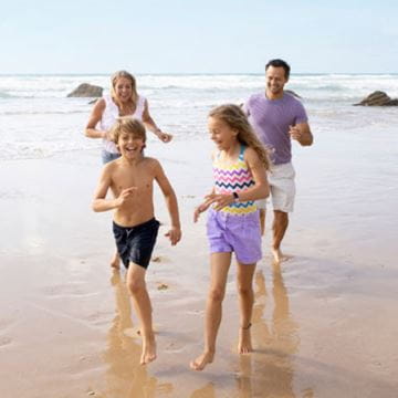 A family playing on a beach