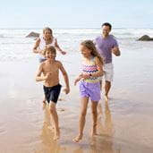 A family playing on a beach