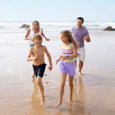 A family playing on a beach
