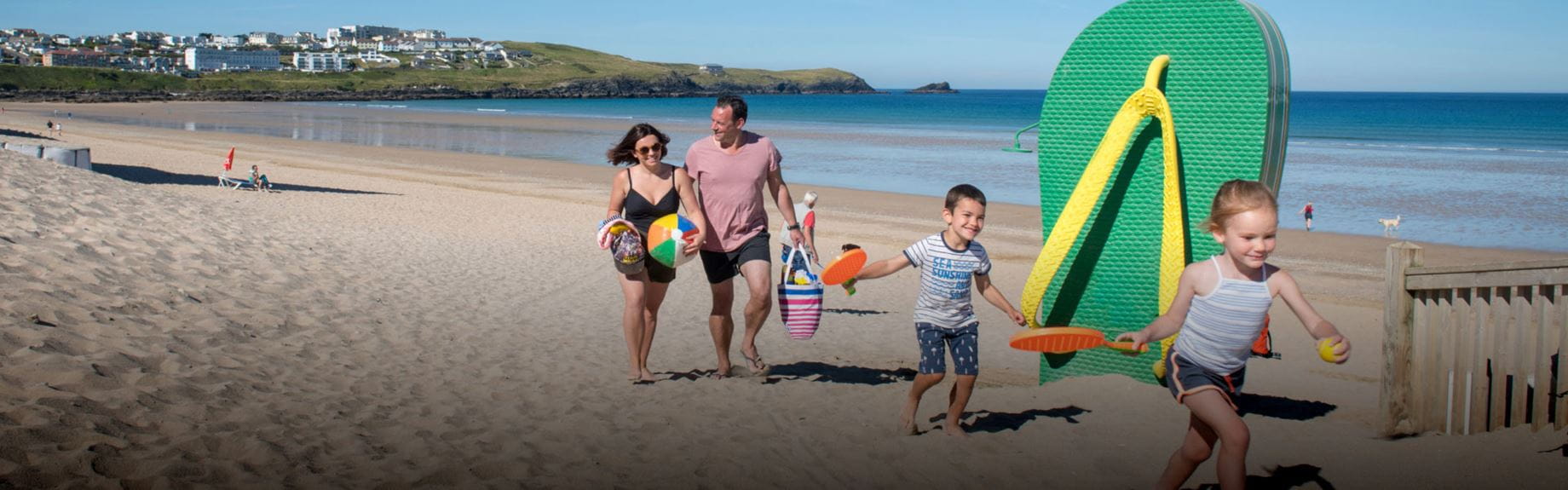 A family on a beach on a sunny day