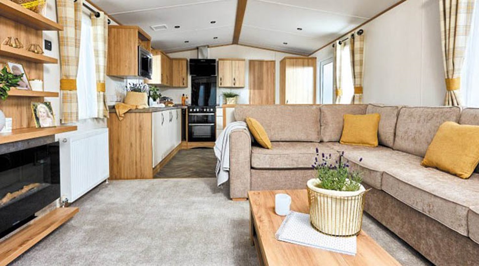 The interior of a caravan living room and kitchen