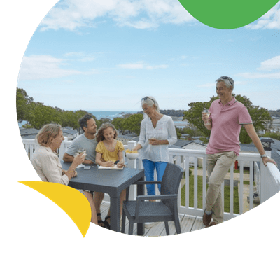 Family on terrace at Nodes Point accommodation
