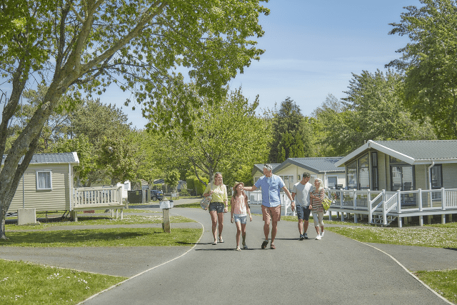 Family walking outside holiday homes