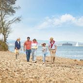 a family walking on a beach