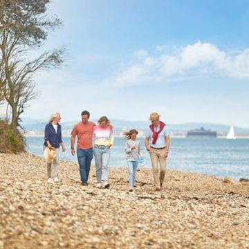 a family walking on a beach