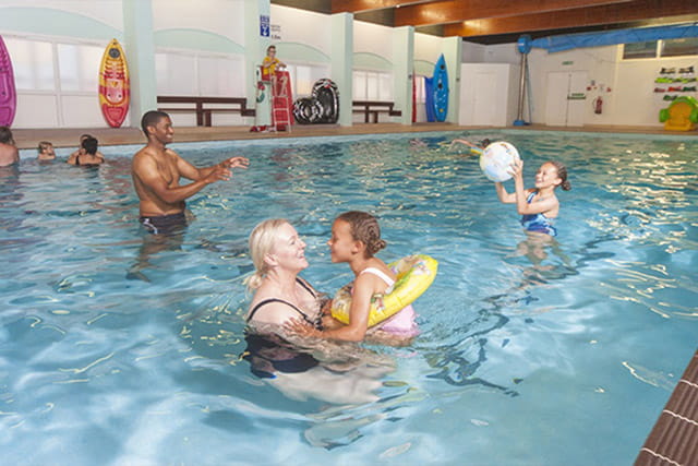 People enjoying the indoor swimming pool
