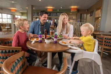 Family enjoying a meal in a restaurant