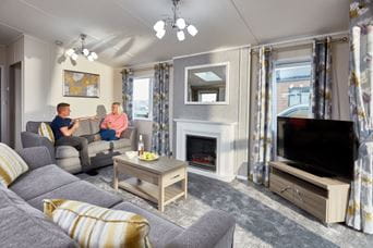 Couple sat on sofa watching TV
