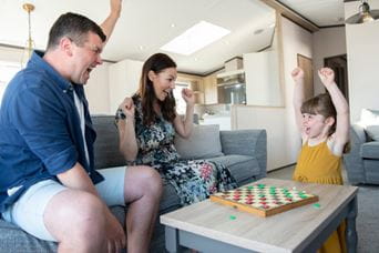 Family playing board game