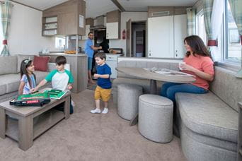 Children playing games on the living room coffee table