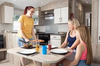 Family sat around dining table