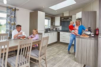 Family in kitchen cooking together