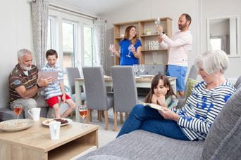 Whole family gathered around smiling