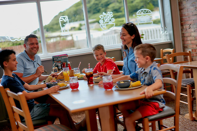 A family enjoying a meal in the restaurant