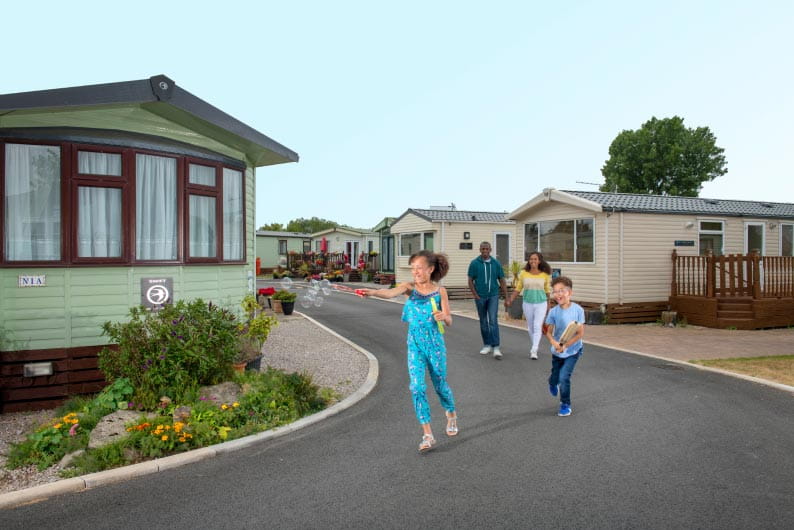 a family outside of a park dean caravan