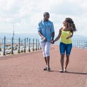 a couple strolling along the sea front