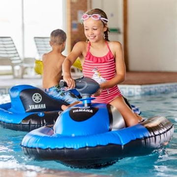 a child on an inflatable jet ski