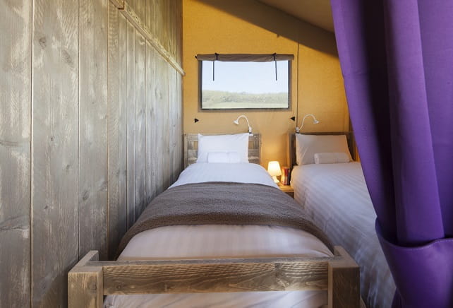 Bedroom in a Safari Plus Glamping tent at Ruda Holiday Park