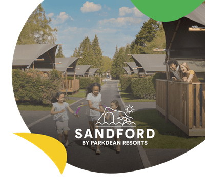 Children walking past glamping accommodation at Sandford