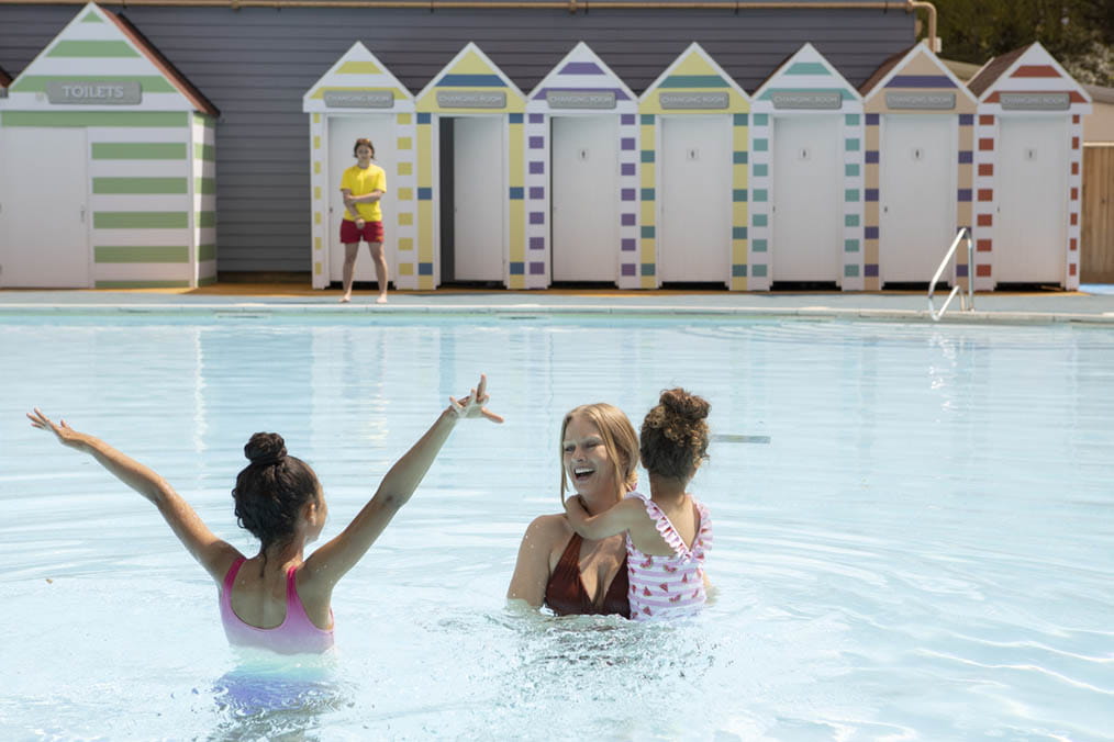 Family swimming in the outdoor pool
