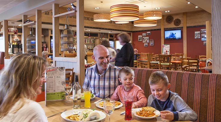 A family enjoying a meal in the restaurant