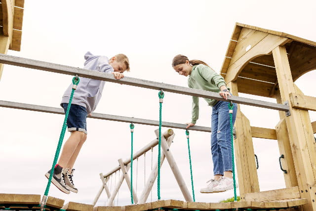Kids playing on the adventure playground at Sandylands Holiday Park