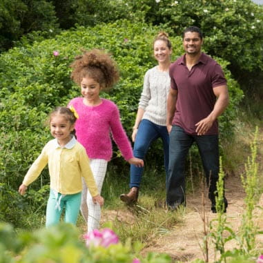 a family walking through countryside