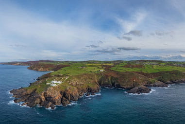 A jagged headland stretching out to sea on Cornwall's western coast