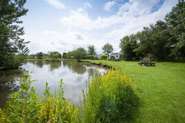 A picturesque view of the lake at Skipsea Sands Holiday Park
