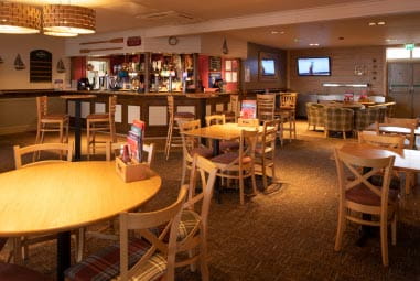 Interior of restaurant with wooden furnishing