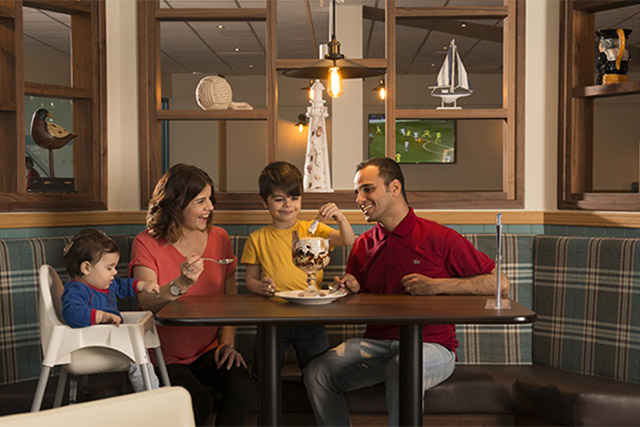A family sharing an ice-cream in the restaurant at Southerness