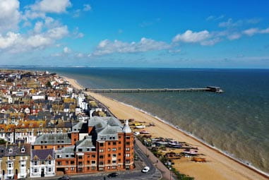 Seaside town with pier stretching into the sea