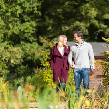 a couple strolling through the countryside 