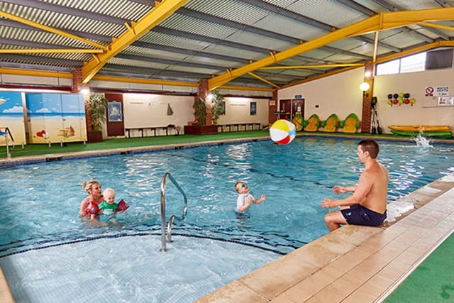family having fun in the indoor pool