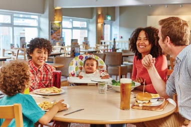a family enjoying a meal at the restaurant