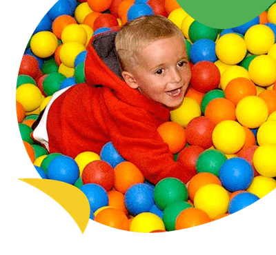 A boy in a ball pit near Sundrum Castle Holiday Park