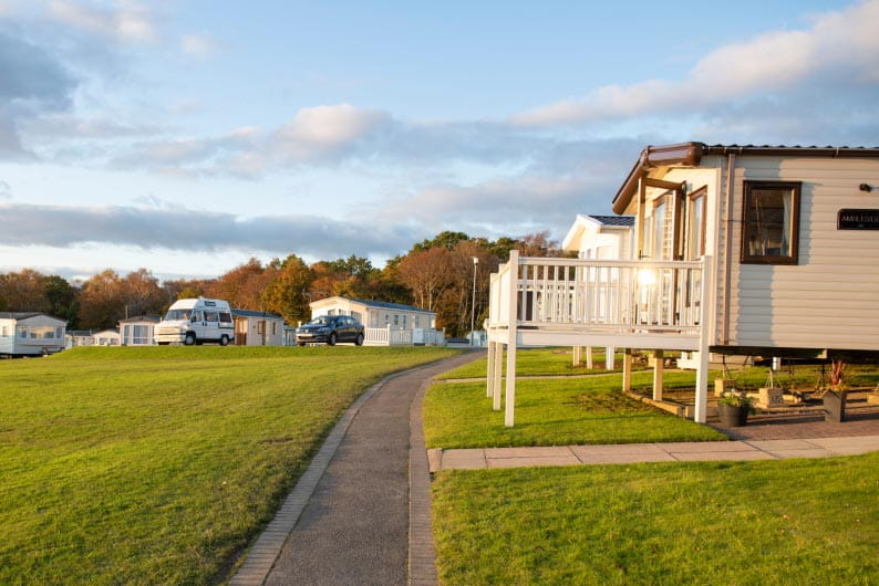 Caravans set amongst green fields