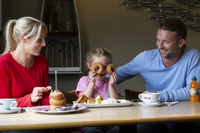 family enjoying a meal in the restaurant