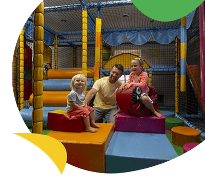Father and kids in soft play area