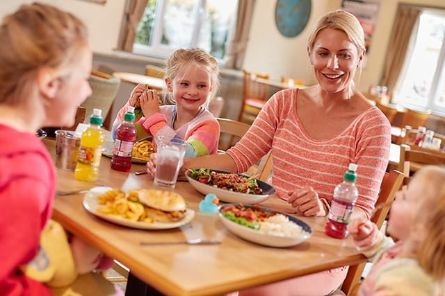 Mother and daughters enjoying dinner at Sunnydale Holiday Park
