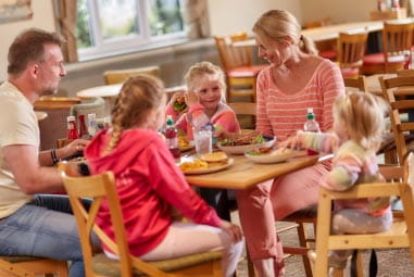 a family enjoying a meal at a restaurant